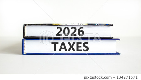 2026 taxes new year symbol. Concept words 2026 taxes on beautiful books. Beautiful white paper background. Business and 2026 taxes new year concept. Copy space. 134271571