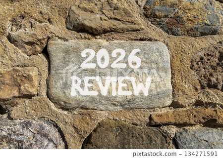 2026 Review symbol. Concept words 2026 Review on beautiful grey stone on stone wall. Beautiful stone wall background. Business and 2026 review concept. Copy space. 2026 Review symbol. Concept words 2026 Review on beautiful grey stone on stone wall. Beautiful stone wall background. Business and 2026 review concept. Copy space. 134271591