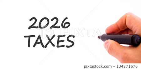2026 taxes new year symbol. Concept words 2026 taxes on beautiful white paper. Beautiful white paper background. Businessman's hand with pen. Business and 2026 taxes new year concept. Copy space. 2026 taxes new year symbol. Concept words 2026 taxes on beautiful white paper. Beautiful white paper background. Businessman's hand with pen. Business and 2026 taxes new year concept. Copy space. 134271676