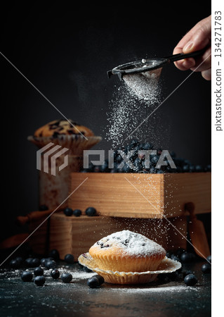 Blueberry muffins and berries in a wooden box. 134271783