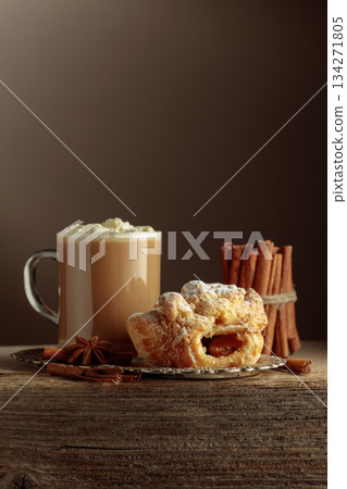 Vienna strudel and caffe latte on a silver tray. Vienna strudel and caffe latte on a silver tray. 134271805