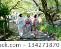 Three women in yukata descending stone steps in a garden with fresh greenery. Kyoto City, Kyoto Prefecture, Japan 134271870
