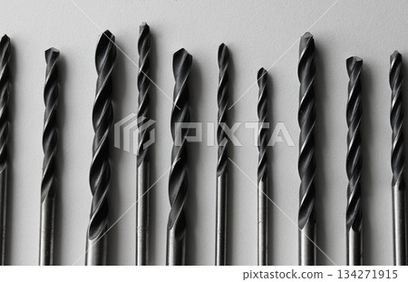 Steel Bits For Drill Driver Laid Out In Order On White. Stock Photo Of Carpenters Equipment Steel Bits For Drill Driver Laid Out In Order On White. Stock Photo Of Carpenters Equipment 134271915