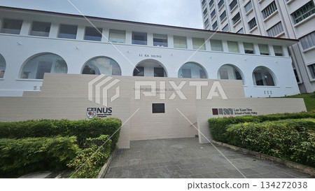 The Li Ka Shing building at NUS features arched windows and a bold quote on knowledge, reflecting academic excellence The Li Ka Shing building at NUS features arched windows and a bold quote on knowledge, reflecting academic excellence 134272038
