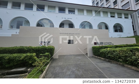 The Li Ka Shing building at NUS features arched windows and a bold quote on knowledge, reflecting academic excellence The Li Ka Shing building at NUS features arched windows and a bold quote on knowledge, reflecting academic excellence 134272039