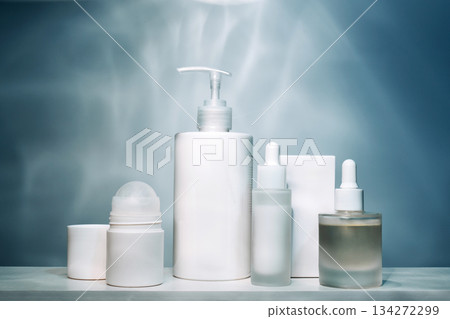 White cosmetic bottles and droppers for skincare routine White cosmetic bottles and droppers for skincare routine 134272299