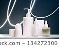 Skincare product packaging with serum and dispenser on white shelf 134272300