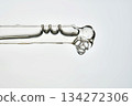 Cosmetic pipette dropping serum with bubbles on white background 134272306