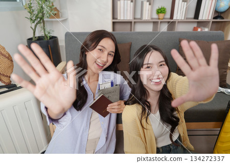 Travel Planning: Happy friends ready for their adventure with passports Travel Planning: Happy friends ready for their adventure with passports 134272337