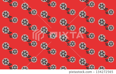 Seamless cinema pattern with film reel on red background, classic movie and film industry wrapping paper design 134272565