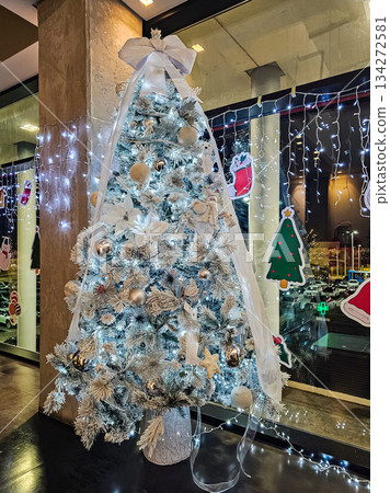 Christmas Tree in Soft White and Blue with Large White Bow 134272581