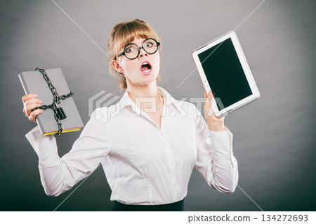Woman with document and tablet. Digital storage. 134272693