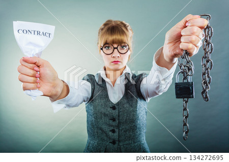 unhappy business woman showing crumpled contract 134272695