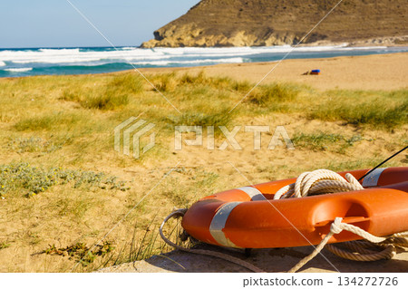 Rescue life buoy on beach Rescue life buoy on beach 134272726