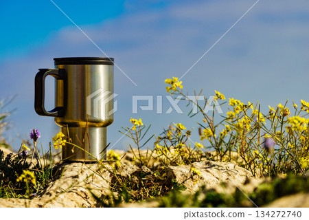 Thermal mug, thermos on nature. Travel outdoor picnic. Thermal mug, thermos on nature. Travel outdoor picnic. 134272740
