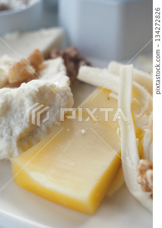 Cheese platter with various types of cheese and nuts Cheese platter with various types of cheese and nuts 134272826