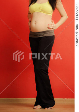 Closeup on tummy of pregnant woman 134272858