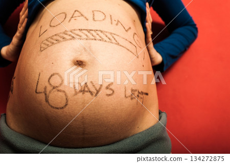 Pregnant woman belly with drawings 134272875