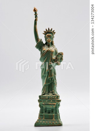 Statue of Liberty miniature figurine souvenir with green patina closeup. 134273004