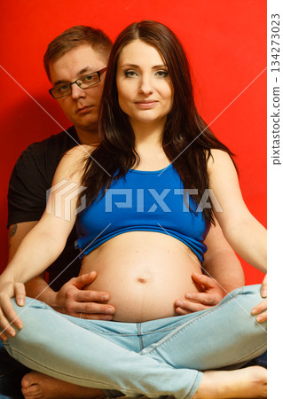 Pregnant woman and man relaxing together 134273023