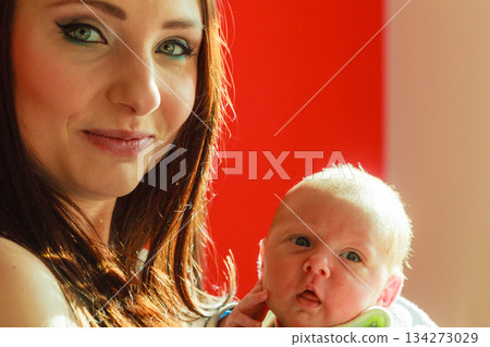 Mother holding her little newborn baby Mother holding her little newborn baby 134273029