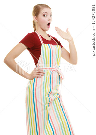 Funny housewife in kitchen apron 134273081