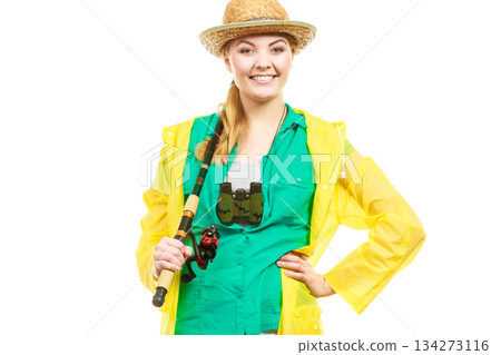 Woman with fishing rod, spinning equipment 134273116