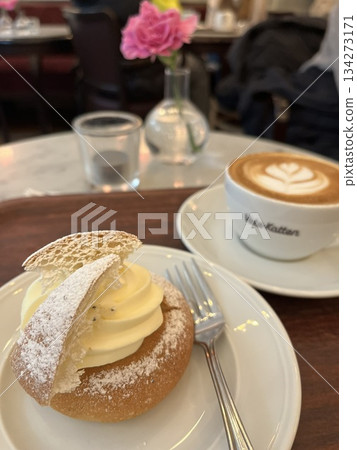 Semla and cappuccino, a seasonal treat, at a long-established cafe in Stockholm, Sweden Semla and cappuccino, a seasonal treat, at a long-established cafe in Stockholm, Sweden 134273171
