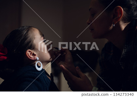 Mother Applies Makeup To Daughter In Soft Home Moment, Tender And Intimate Scene Mother Applies Makeup To Daughter In Soft Home Moment, Tender And Intimate Scene 134273340