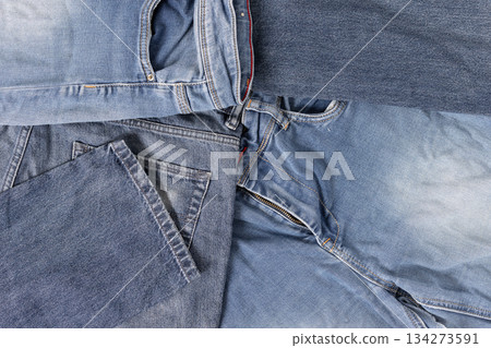 Denim jeans abstract background showing textile waste and fast fashion problems. Full frame 134273591