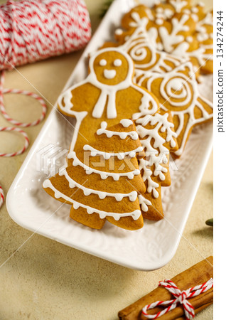 Holiday background. Christmas gingerbread cookies, festive food, home baking. Flat lay 134274244