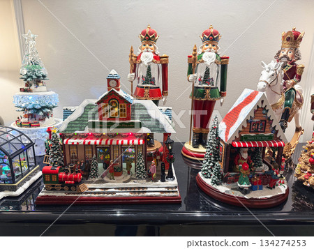 Musical Christmas train station with lights and festive decorations. Musical Christmas train station with lights and festive decorations. 134274253