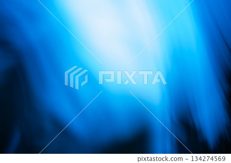 Light streaks create soft abstract pattern in shades of blue and purple. Blurred gradient forms gentle flowing motion reminiscent of fiber connections. Light streaks create soft abstract pattern in shades of blue and purple. Blurred gradient forms gentle flowing motion reminiscent of fiber connections. 134274569