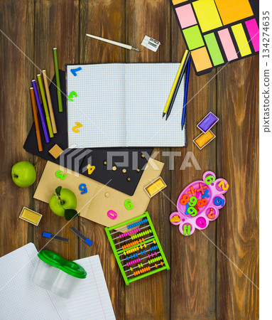Top down flat lay representing the idea of going back to school. Mock up sheet of white paper and vintage objects for school top view. Top down flat lay representing the idea of going back to school. Mock up sheet of white paper and vintage objects for school top view. 134274635