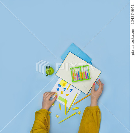 Young adult woman teachers hands on table background. Modern methods and approaches to studying mathematics 134274641