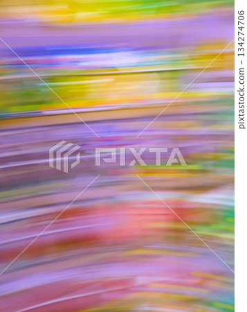 Blurred motion background of many books on bookshelf in library Blurred motion background of many books on bookshelf in library 134274706