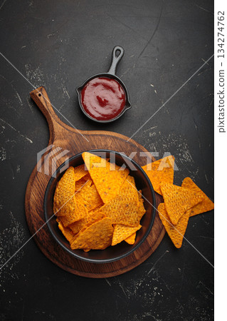 Nachos tortilla chips salsa dip wooden board Mexican Tex-Mex snack fast food 134274762