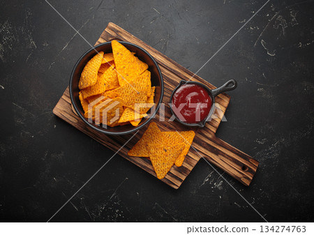 Nachos tortilla chips salsa dip wooden board Mexican Tex-Mex snack fast food 134274763