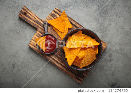 Nachos tortilla chips salsa dip wooden board Mexican Tex-Mex snack fast food 134274765