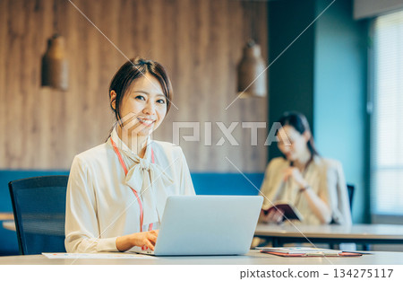 Business woman using a personal computer in the office Business woman using a personal computer in the office 134275117