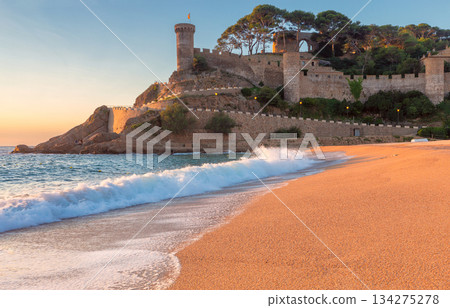 Medieval fortress and beach at sunrise, Tossa de Mar, Spain 134275278