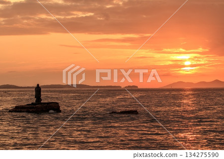 Minamichita Town, the statue of Jōroku Daishi at Seizaki and the sunrise over Chita Bay 134275590