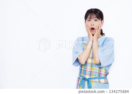 Surprised housewife 134275884