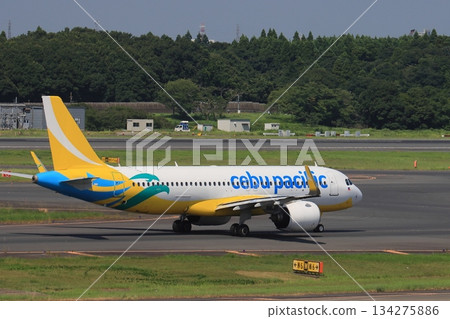 Cebu Pacific Airways aircraft taxiing towards the runway 134275886