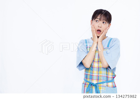 Surprised housewife 134275982