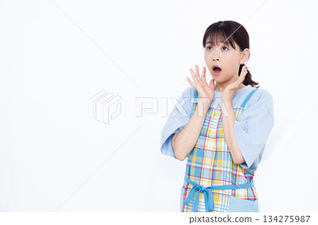 Surprised housewife 134275987