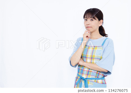 A housewife who is seriously worried A housewife who is seriously worried 134276075