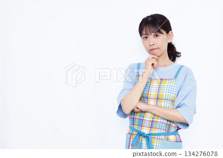 A housewife who is seriously worried 134276078