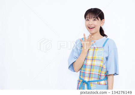 Housewife smiling and surprised Housewife smiling and surprised 134276149