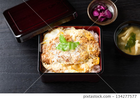 A hearty, freshly made pork cutlet rice bowl 134277577